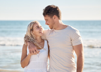 Happy, love and smile with couple at beach for relax, travel and summer by the sea. Freedom, support and hug with man and woman on date vacation together for bonding, affection and ocean holiday