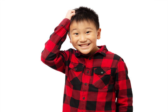 Funny kid scratching head wearing red shirt isolated on white background
