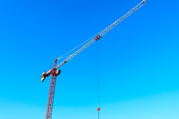 ,tower crane against the sky and Ostankino TV tower