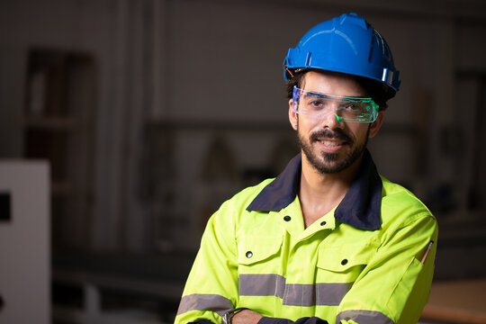 Handsome engineer using smart watch for control fluorescent smart digital glasses with futuristic holographic interface to display data and repair defects of equipment in the factory. - Powered by Adobe