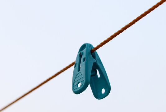 Selective Focus on plastic clothespins on a rope. Round shape Clothespin with rope. 