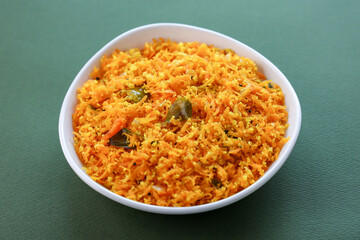 Carrot thoran , stir fried carrots with herbs and spices. healthy vegetarian diet meal. vegan appetizers background in Kerala India. 