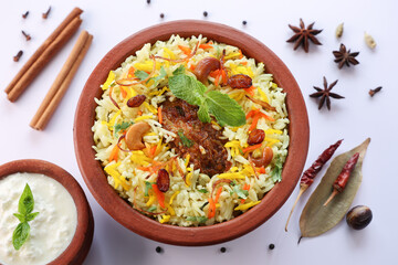 Chicken biryani Spicy Indian Malabar biryani Hyderabadi biryani, Dum Biriyani pulao golden bowl Kerala India Sri Lanka Pakistan basmati rice mixed rice dish with meat curry Ramadan Kareem, Eid