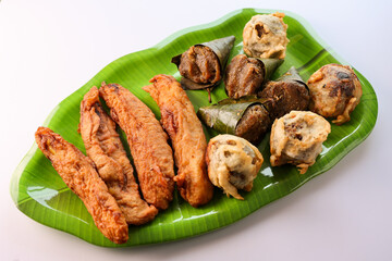 Sukhiyan or Sugiyan banana fry pazham pori Ila Ada Sweet rice dumplings Elayada steamed rice cakes wrapped in banana leaves famous breakfast or tea snacks of Kerala India.