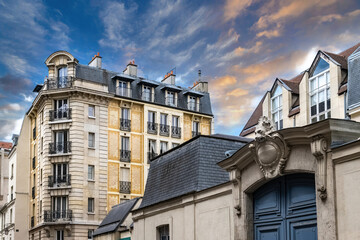 Paris, luxury building in the Marais, in the center of the french capital, sunset
