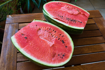juicy watermelon cut into triangles and slices