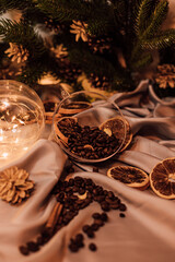 Christmas composition with coffee beans, dried oranges and garland