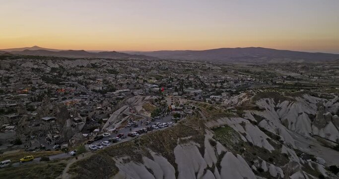G&ouml;reme Turkey Aerial v7 cinematic low level drone flyover lookout view point capturing breathtaking view of cappadocia landscape and ancient cave town at sunset - Shot with Mavic 3 Cine - July 2022