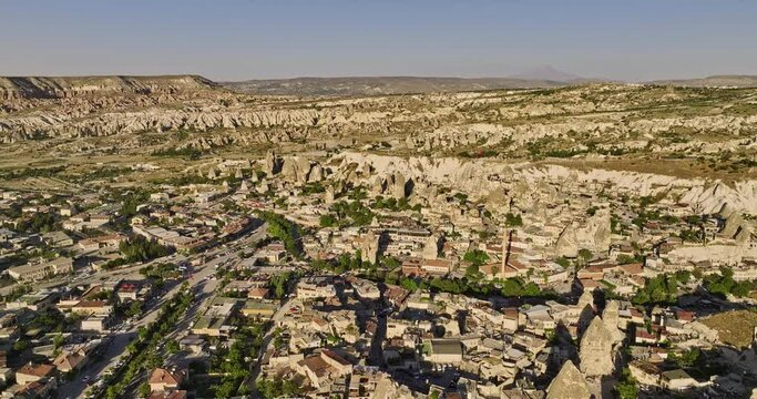 G&ouml;reme Turkey Aerial v20 panoramic landscape view, flyover ancient town capturing major street running across the old village surrounded by unique rock formations - Shot with Mavic 3 Cine - July 2022