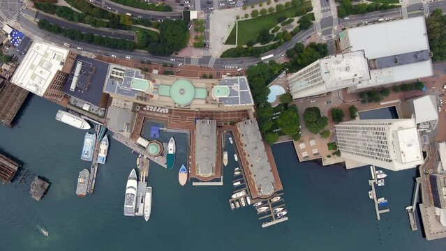 Downtown Boston, Massachusetts by the India Warf harbor and skyscrapers - straight down aerial view