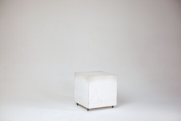 Cube on white background on cyclorama. Photo studio. 
