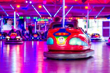 Deurstickers Soest, Germany - November 04, 2022: People riding bumper cars at  at the fair. © Олександр Луценко