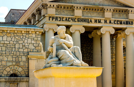 Sculpture god - doctor Eskulap.City Yessentuki, Northern Caucasus.There is an inscription on the building:Semashko Mud Baths