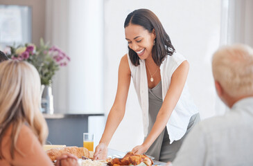 Happy woman hosting food at dinner table in home, house and dining room for family lunch, meal and...