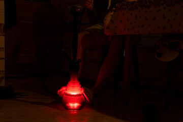 A man smokes hookah in the kitchen in the dark during a power outage in Ukraine, we cannot be...
