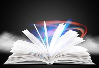 Retro book open with magic smoke