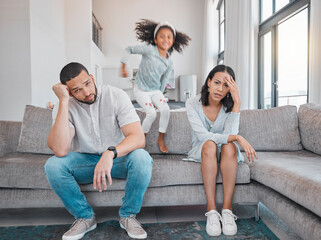 Tired, couple and family with adhd girl jump fast on sofa in house living room or home. Man, woman and parents with burnout, depression or anxiety from autism, energy and mental health kid and stress