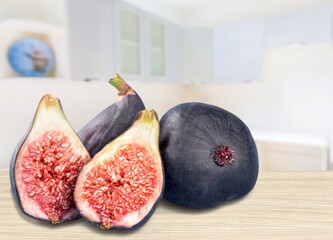 Fresh tasty ripe figs fruits on desk