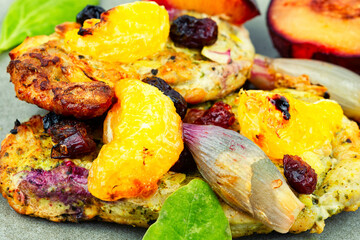 Meat baked with tangerines and plums.