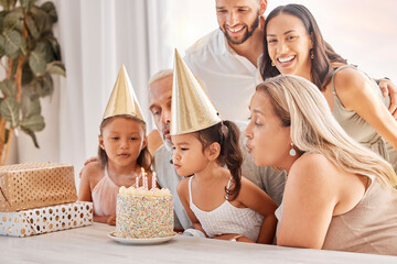 Family, kids and birthday cake with a child and her big family celebrating with a party for fun...
