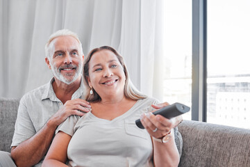 Senior couple, watching tv and relax on sofa in living room together for happy retirement. Love,...