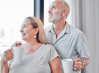 Elderly couple, hug and coffee by window with smile in contemplation, vision or morning routine at...