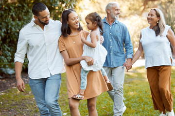 Family, walking and together in park with love and spending quality time outdoor, for bonding and care. Grandparents, parents and child walk, happy in nature and happy family generations.