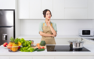 Portrait of a housewife in the kitchen at home