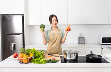 Portrait of a housewife in the kitchen at home