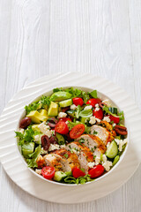 Mediterranean grilled Chicken Salad in white bowl