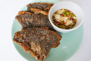Fried tilapia in green plate and dipping sauce | Homemade easy food