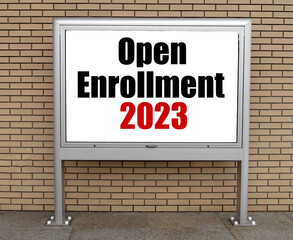 Fototapeta premium Open Enrollment 2023 words on bulletin board.
