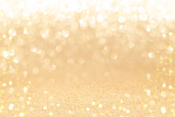 Golden sparkling background with shiny blurred round bokeh.