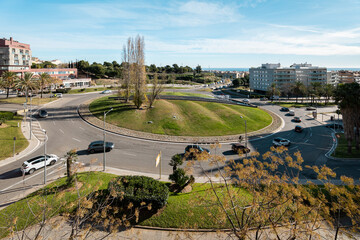 Street road roundabout or circle intersection of car traffic on sunny day in Mataro, Spain.