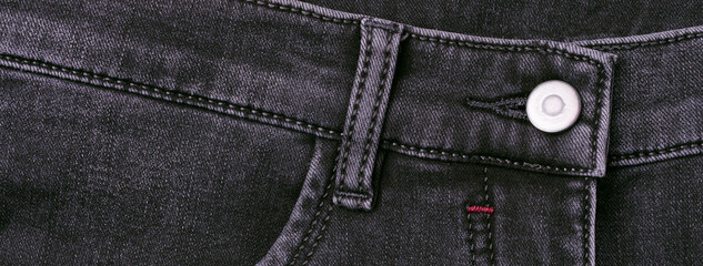 Part of dark jeans.