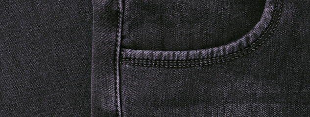 Part of dark jeans.