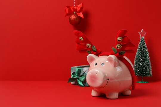 Concept of Christmas finance with piggy bank, space for text