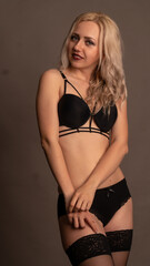 Fototapeta premium Sexy woman in exquisite lace lingerie in studio.