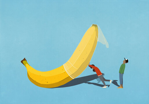 Couple placing condom on large banana

