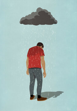 Rain cloud over depressed man
