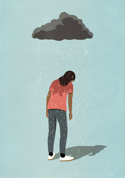 Rain cloud over depressed woman
