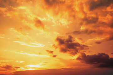 Naklejka na ściany i meble Golden cloudy sky at sunset. Sky texture, abstract nature background