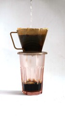 pouring hot water to make coffee