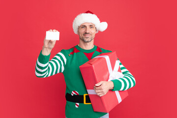 happy new year. merry christmas gift. man holding debit card for shopping.