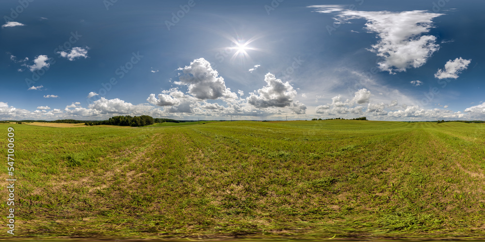 Wall mural full seamless 360 hdri panorama view among farming field with sun and clouds in overcast sky in equi