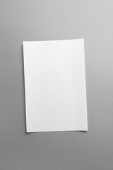 White blank paper page with shadow isolated on grey color background