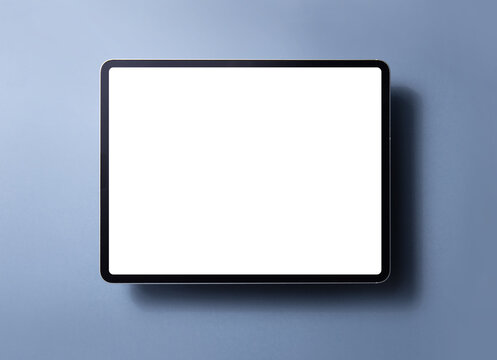 Tablet computer with blank screen isolated on color background
