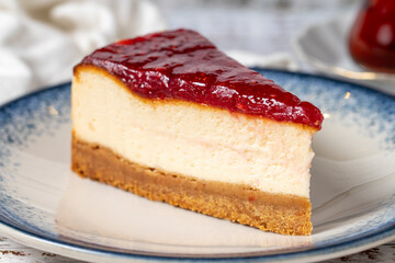 Cheesecake on a white wooden background. New York cake. American food culture. Bakery desserts. close up