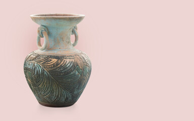 old and dirty brown and blue earthenware vase with ears on pink background, object, decor, vintage,...