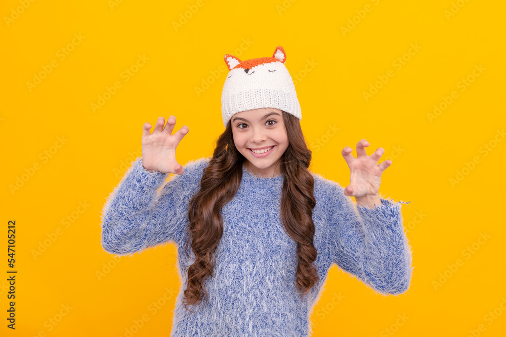 Sticker happy kid long hair in knitted hat on yellow background, winter clothing